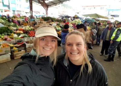 Students at market in Ecuador