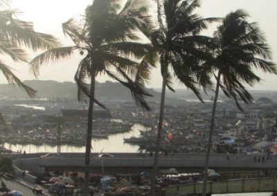 Coast of Ghana, featuring palm trees.