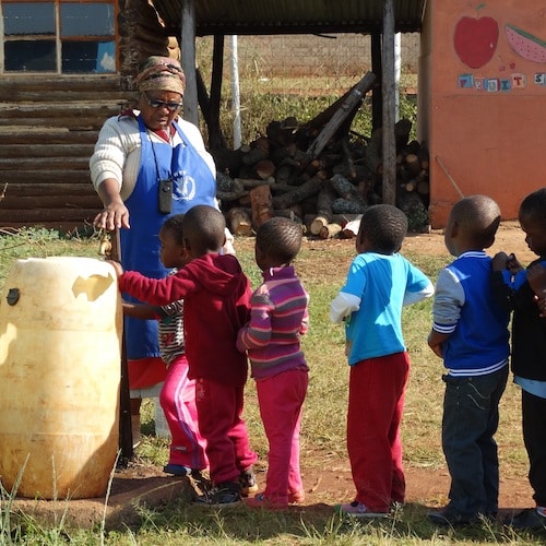 kids in line for handwashing before breakfast