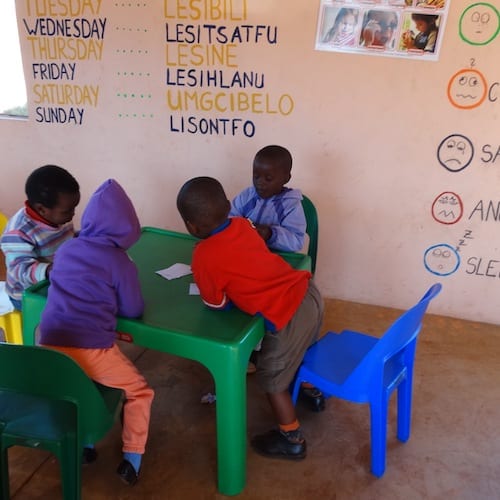 group of orphans at ncp table and chairs