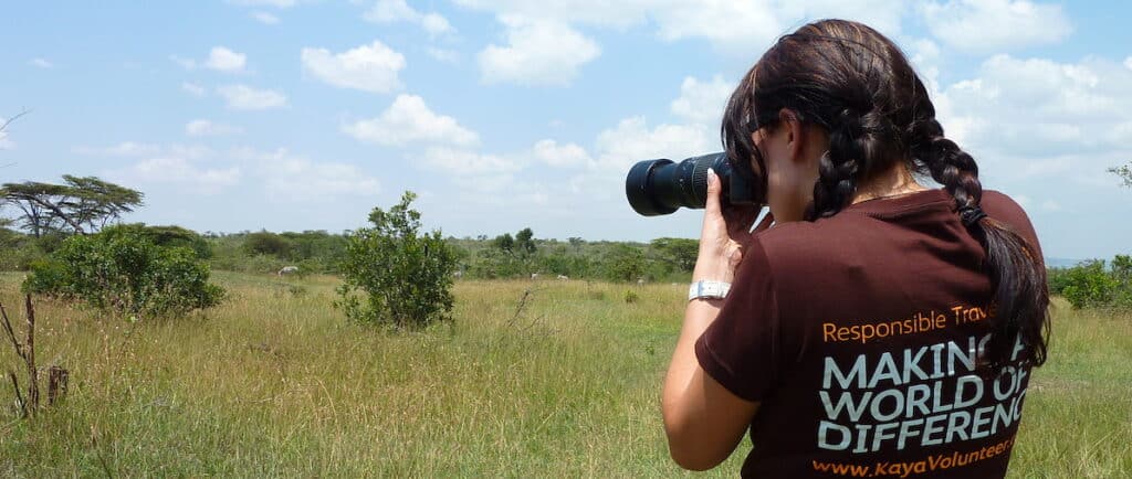 intern with camera on the masai maara safari