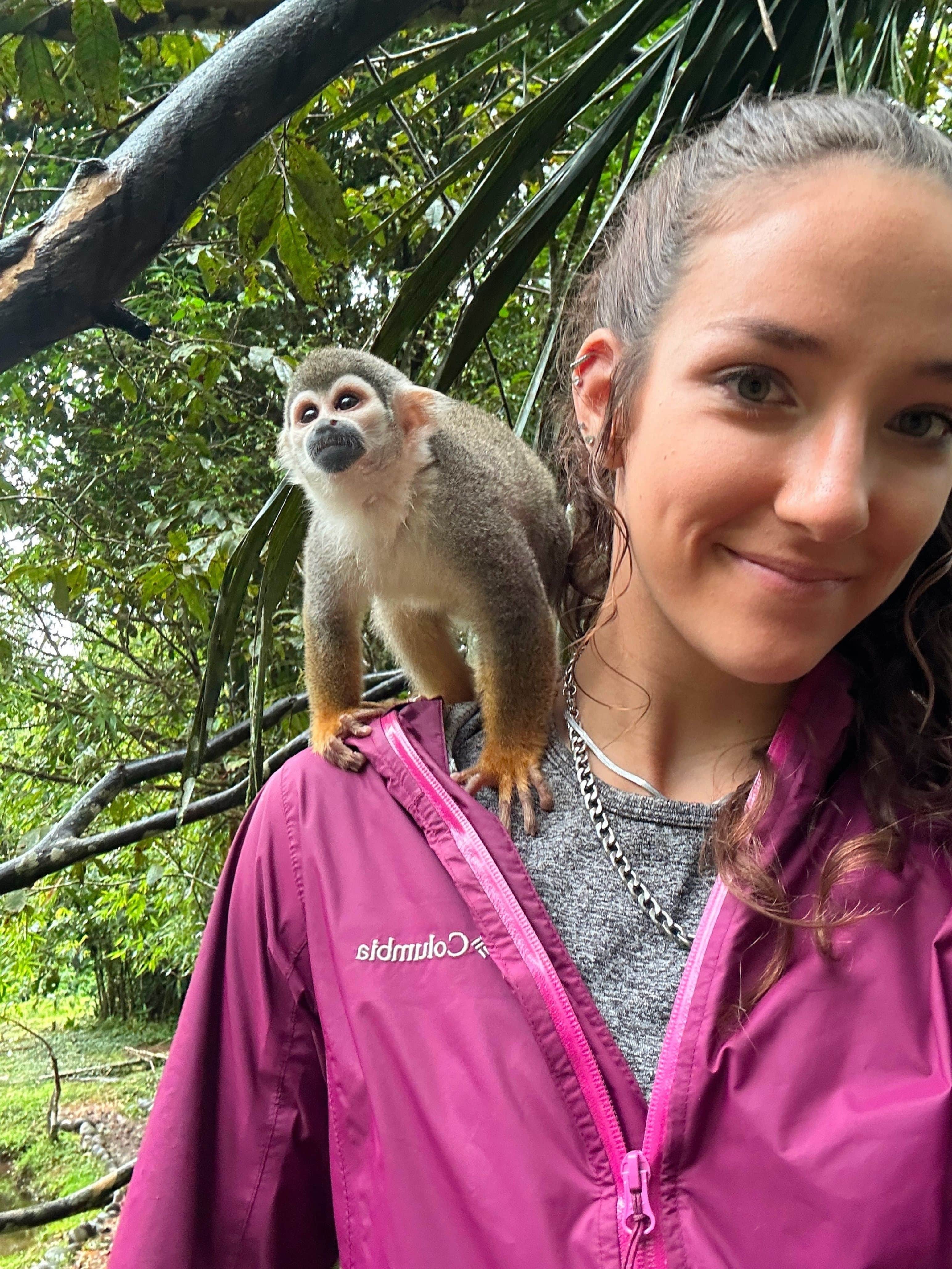 Carly McClung with monkey in Ecuador